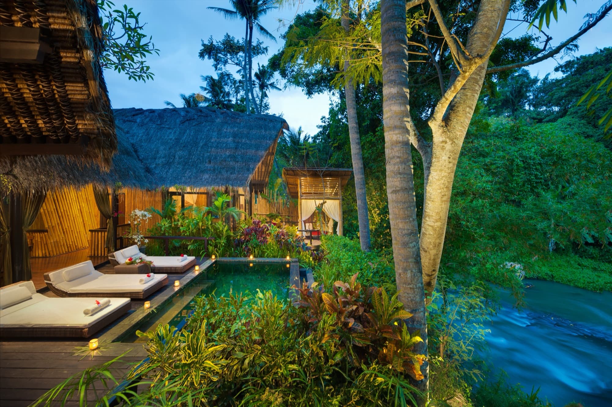 Private suite pool at dusk overlooking the Ayung river