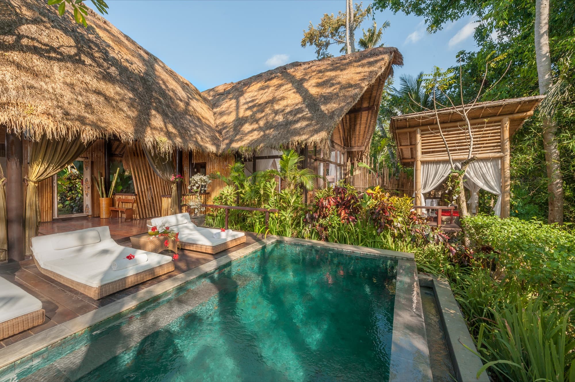 Private suite pool with bamboo bale and daybeds