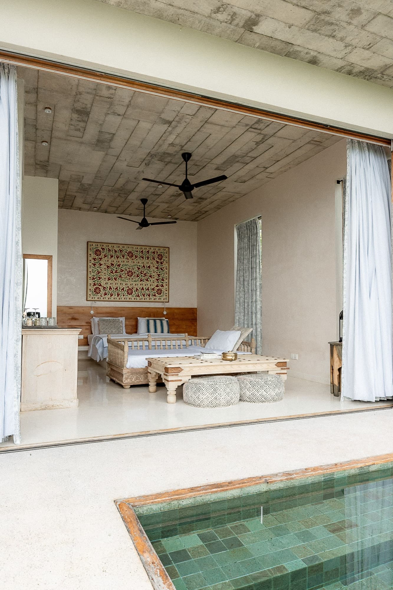Open, contemporary villa interior in timber and stone
