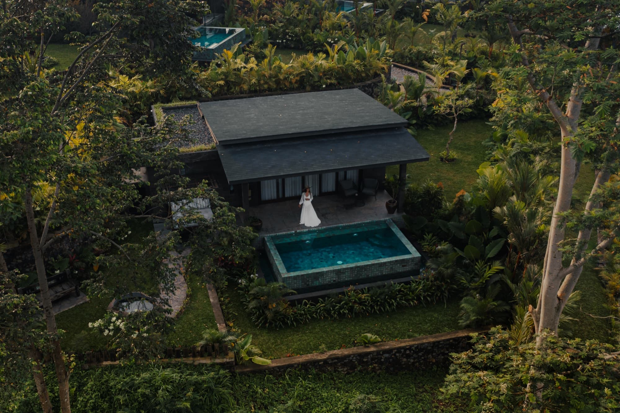 Aerial view of a Wellness Villa with private pool surrounded by tropical garden