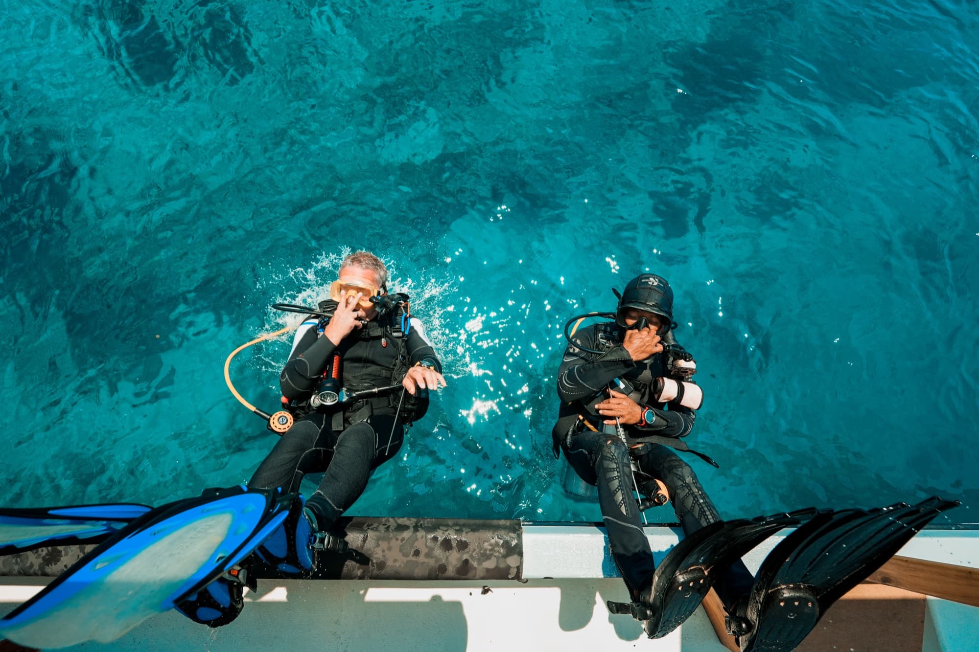 Divers preparing on the boat at Coral Eye, Bangka Island