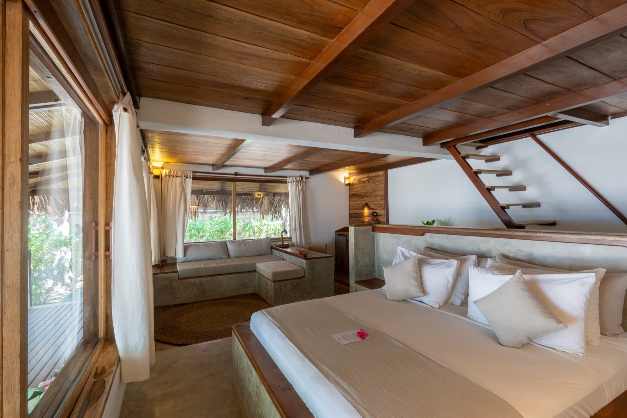 Beach View Villa open-air bathroom set against the garden at Coral Eye