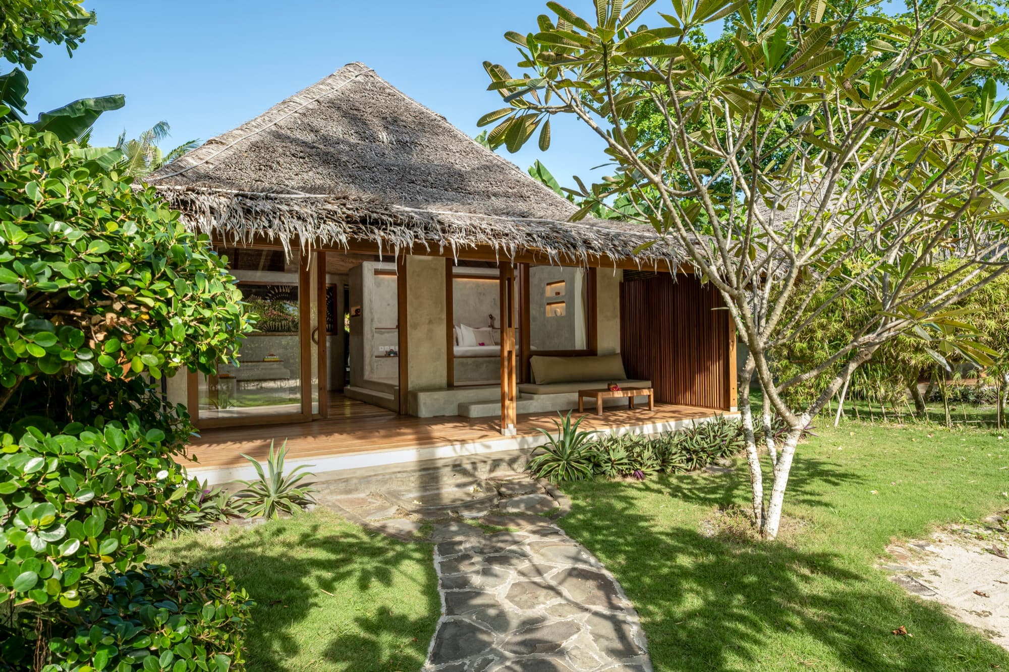 Beach View Villa with a shaded veranda opening onto the beach at Coral Eye
