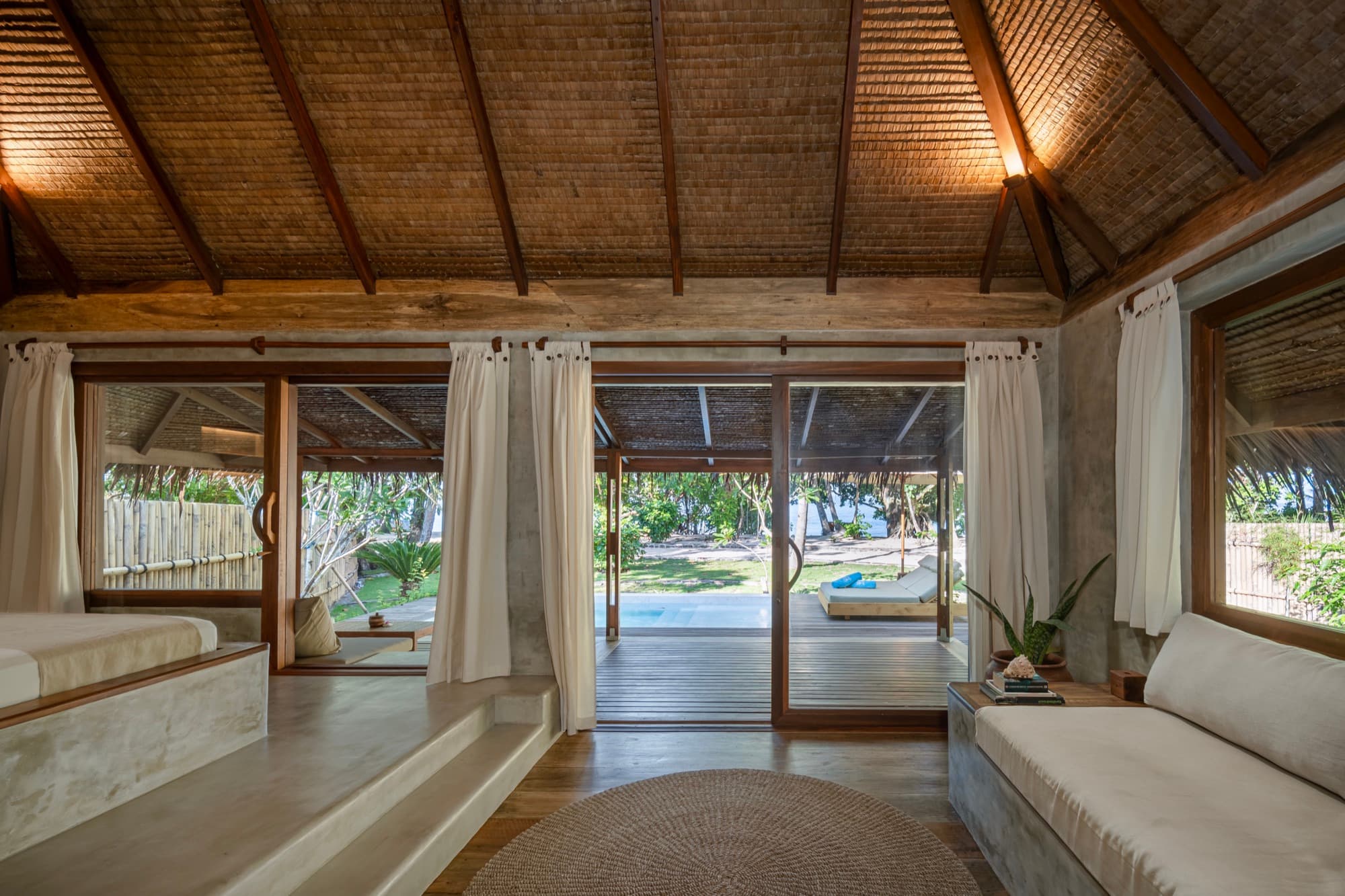 Bedroom of a Beachfront Pool Villa at Coral Eye, Bangka Island