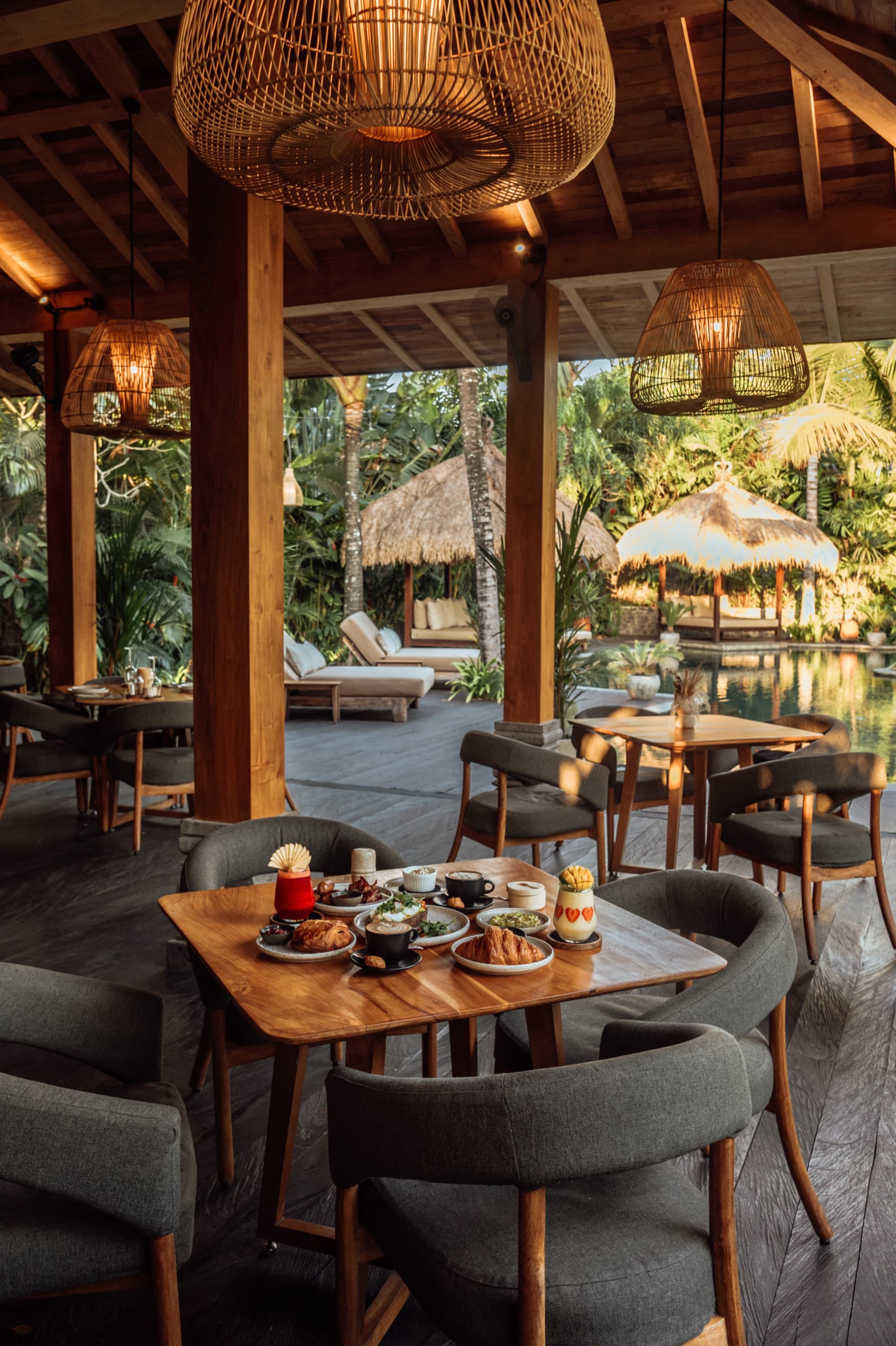 Breakfast in the open-air Ijo restaurant pavilion overlooking the pool and daybeds