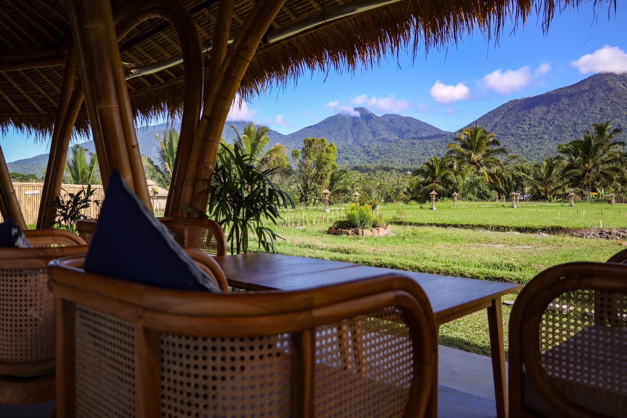 View of Mt Batukaru and rice fields from the open-bamboo Nadi Farm Café