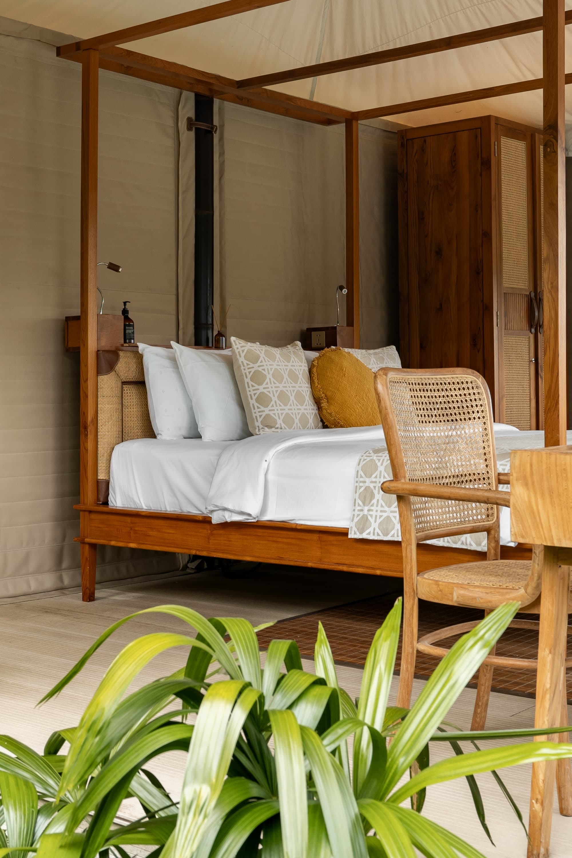 Breeze Tent bedroom with canopied bed, desk and jungle view