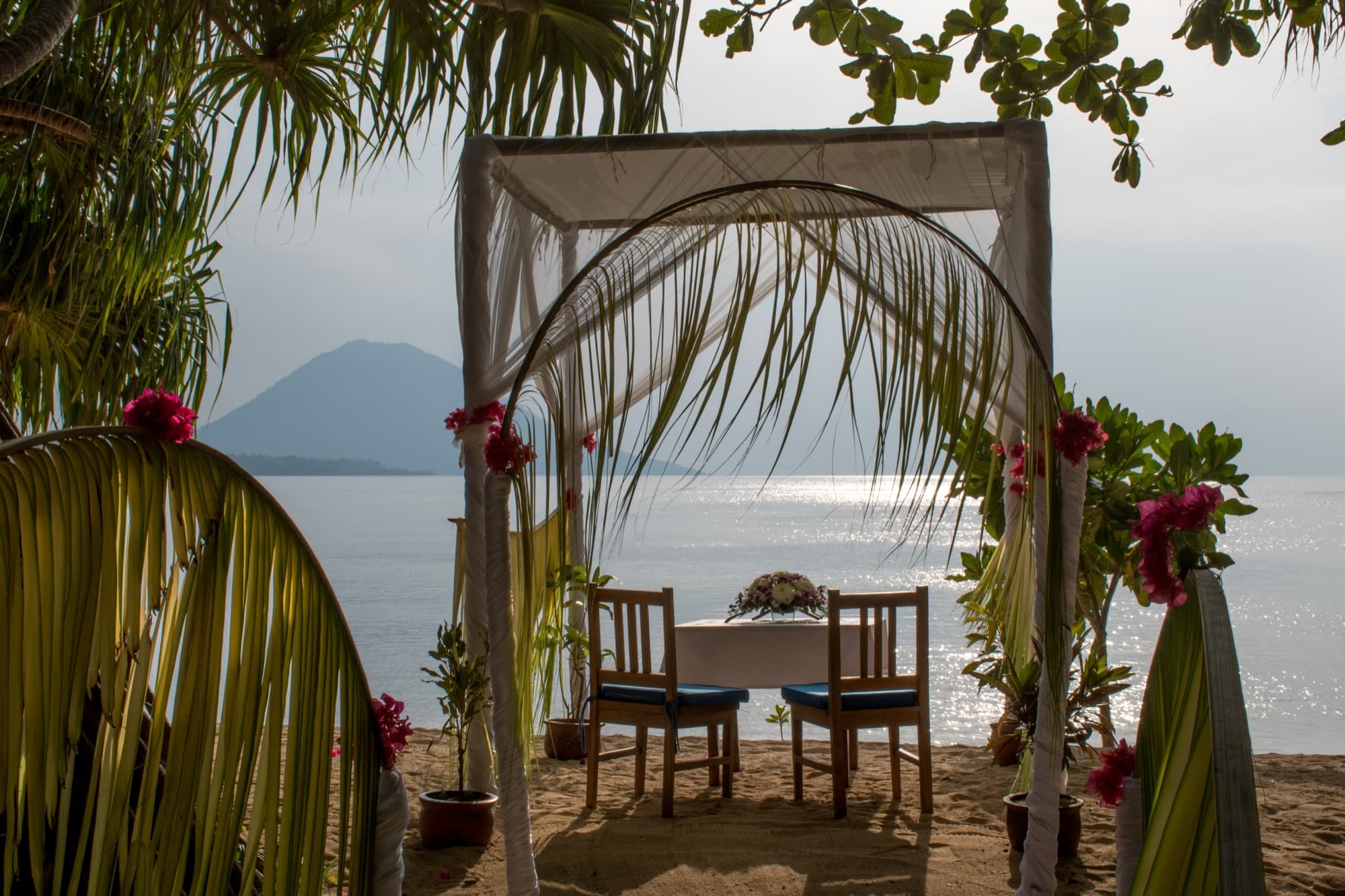 A private dinner set on the beach at Siladen