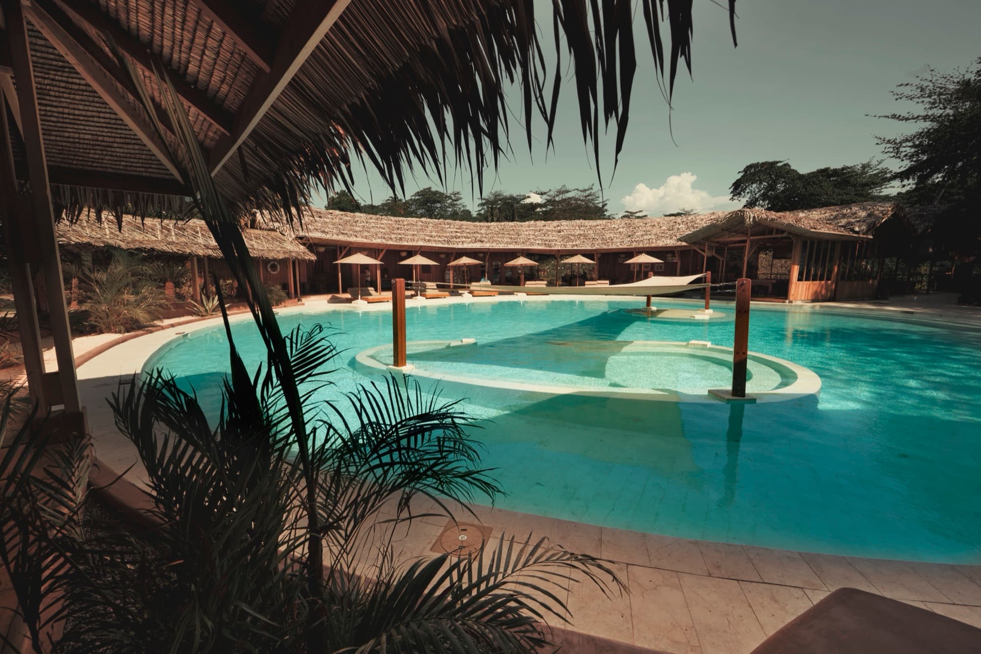The freeform saltwater pool with a sunken bar at the heart of the resort