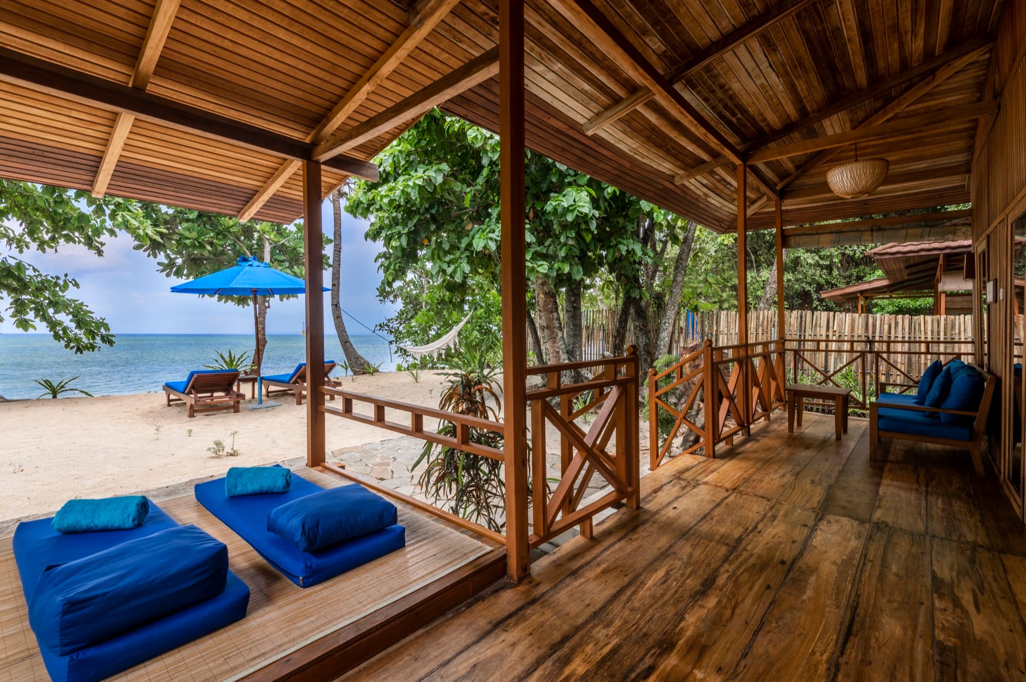 Beach Villa interior with a king-size bed at Siladen