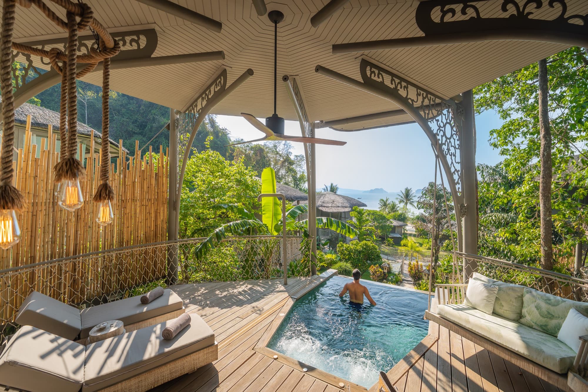 Private plunge pool on a timber deck below the villa, open to the jungle and the bay