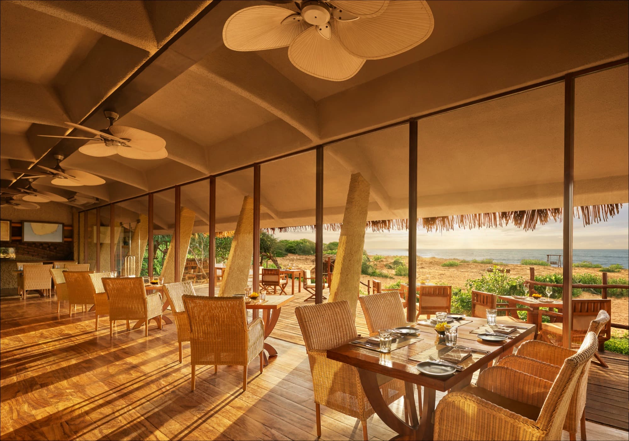 Basses restaurant by day, open to the coast