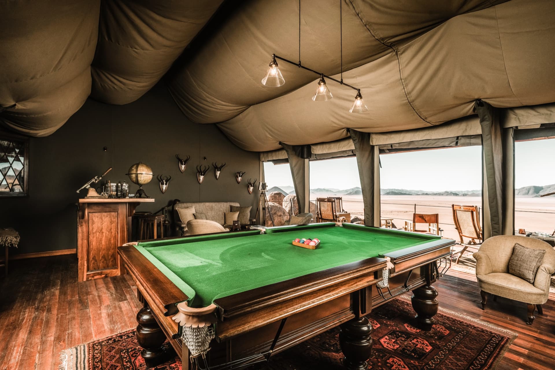 Billiard table in the Cocktail & Cigar Lounge, with views of the desert