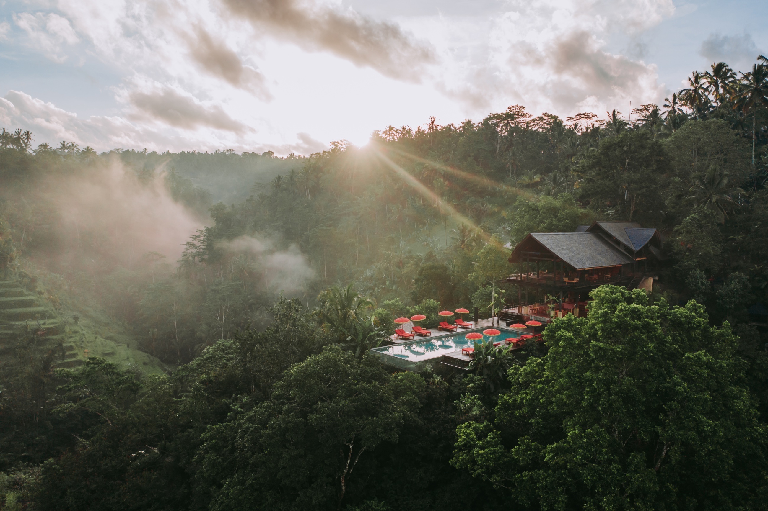 Aerial view of Buahan, a Banyan Tree Escape at sunrise — jungle resort near Ubud, Bali