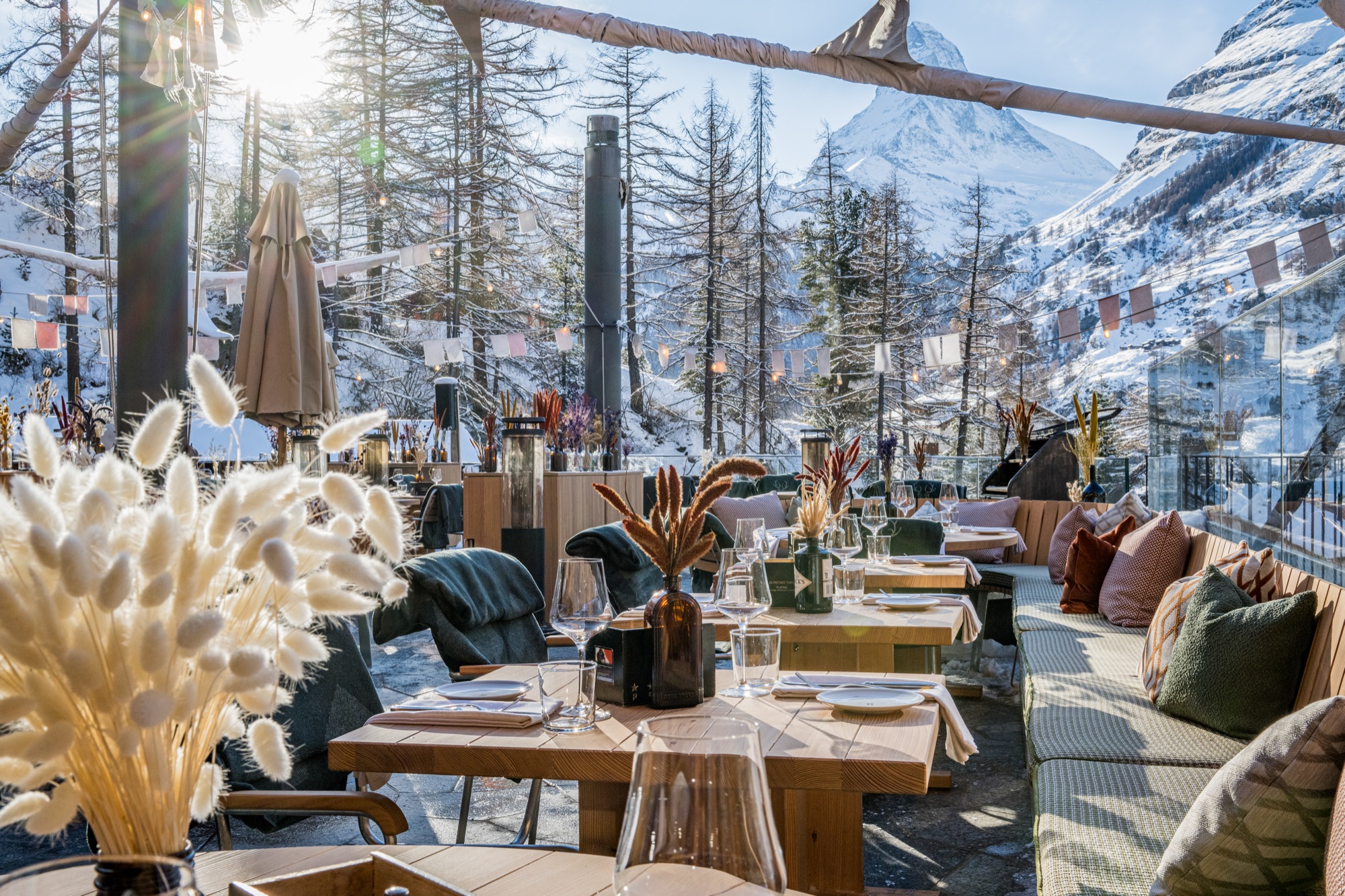 Tables on the restaurant terrace in winter, decorated with dried flowers