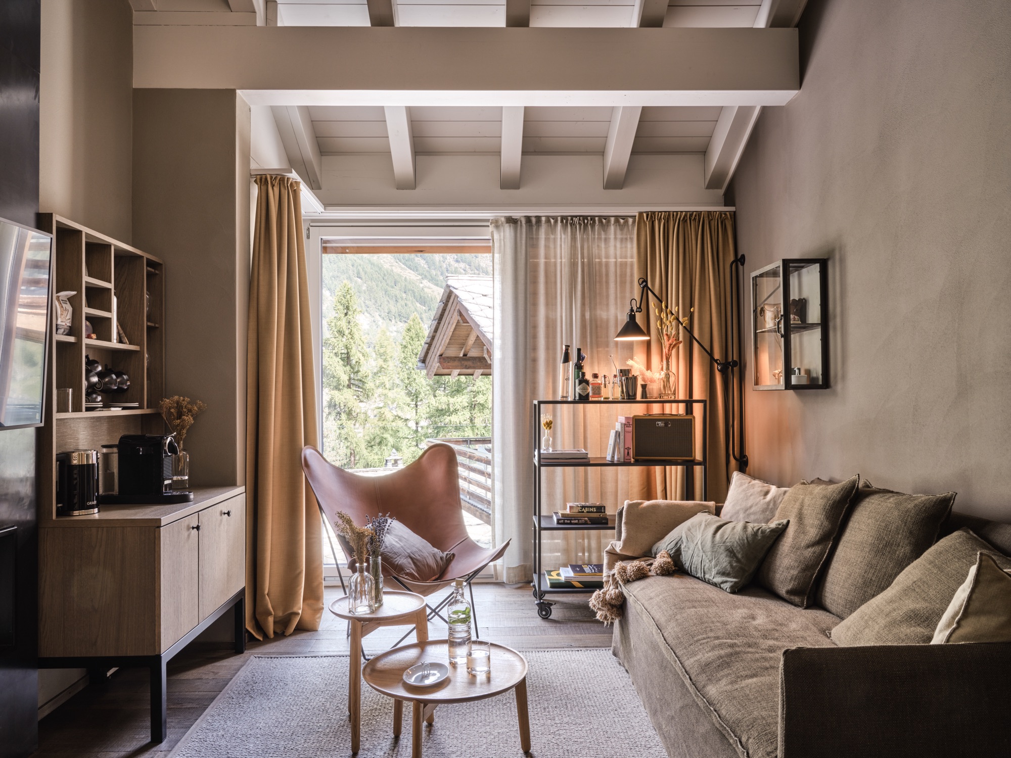 Living area with a sofa and a door onto the balcony