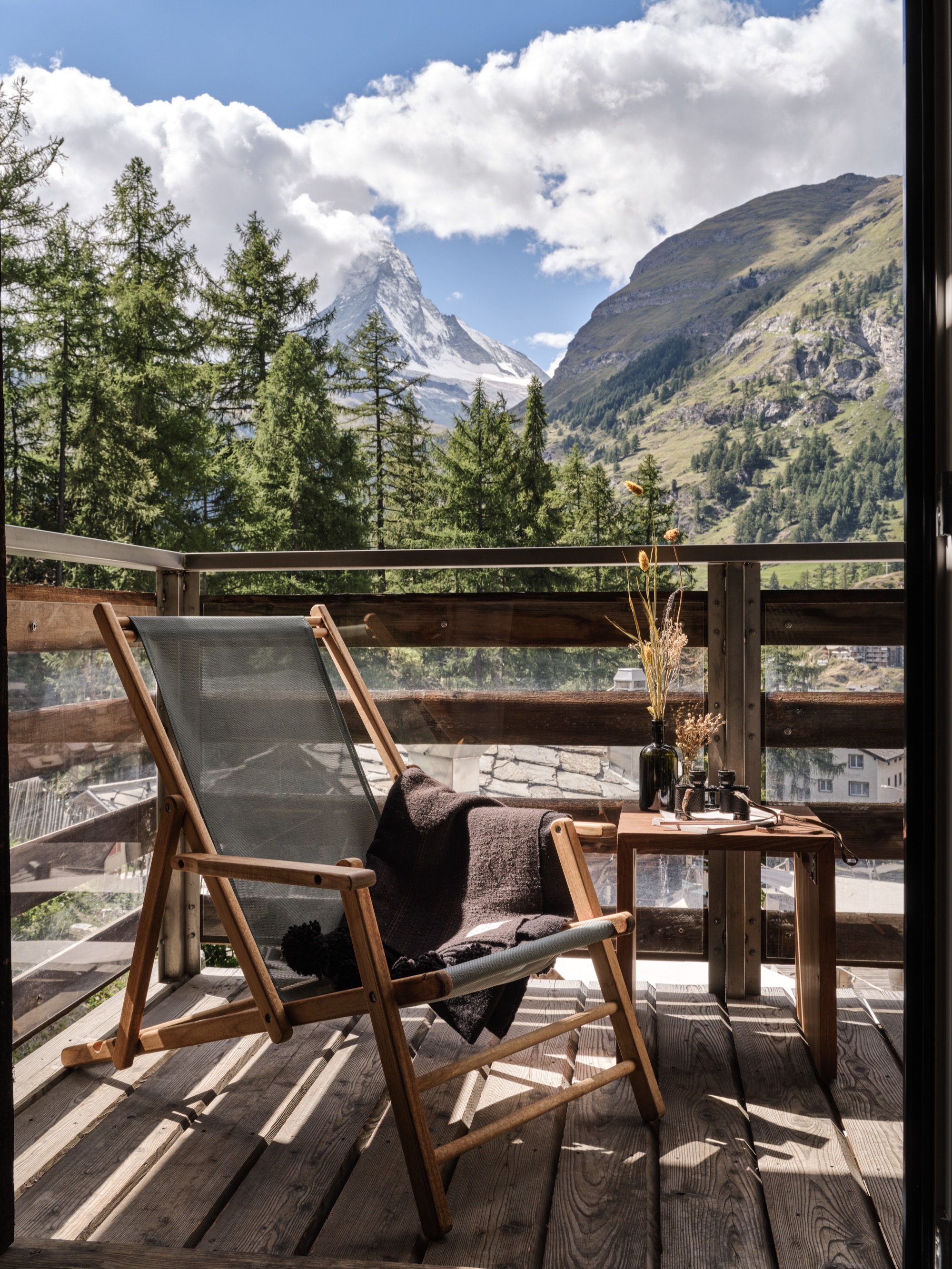 Deckchair on a wooden balcony, with the Matterhorn in view