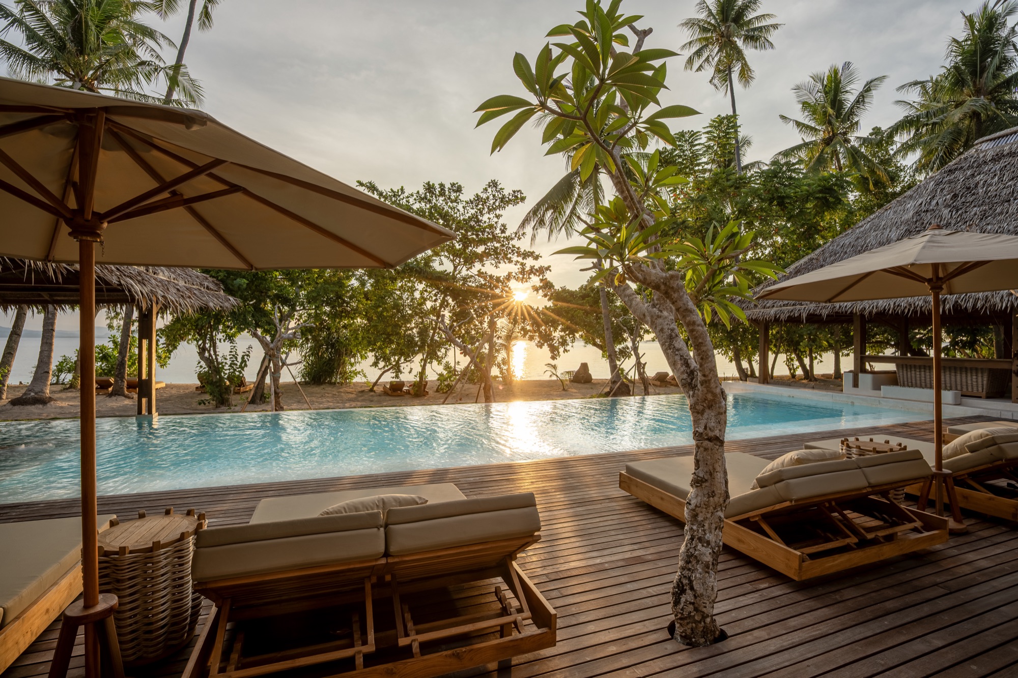 The 26-metre saltwater pool beside the Beach Pavilion, opening to the sea, Coral Eye, Bangka Island