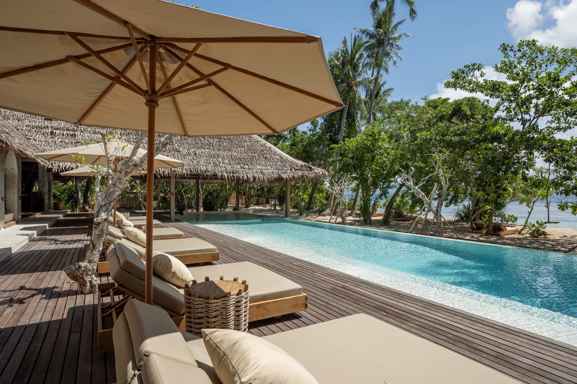 The saltwater pool and Beach Pavilion at Coral Eye, seen from the deck