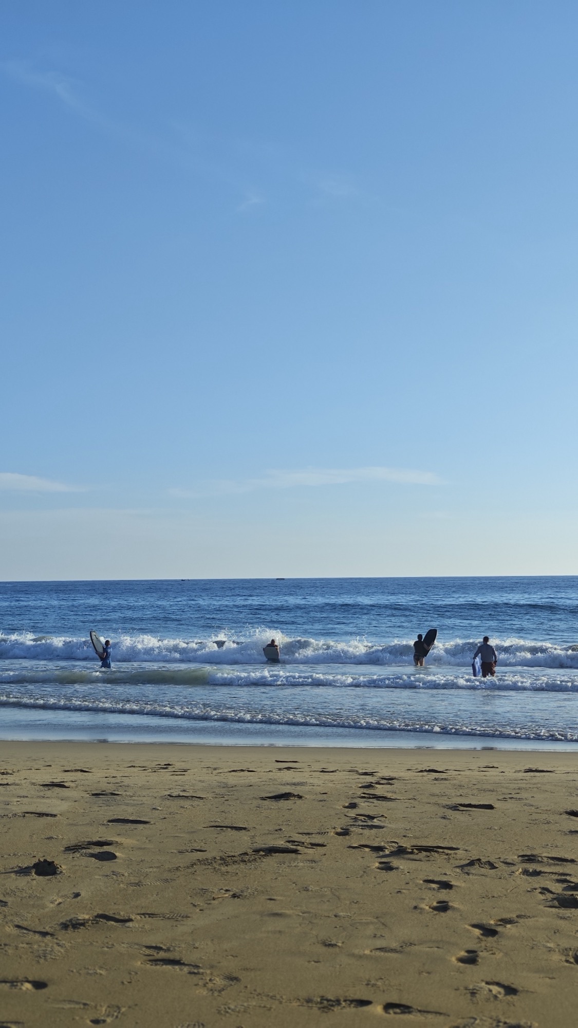 Bodyboarding in the waves at dawn