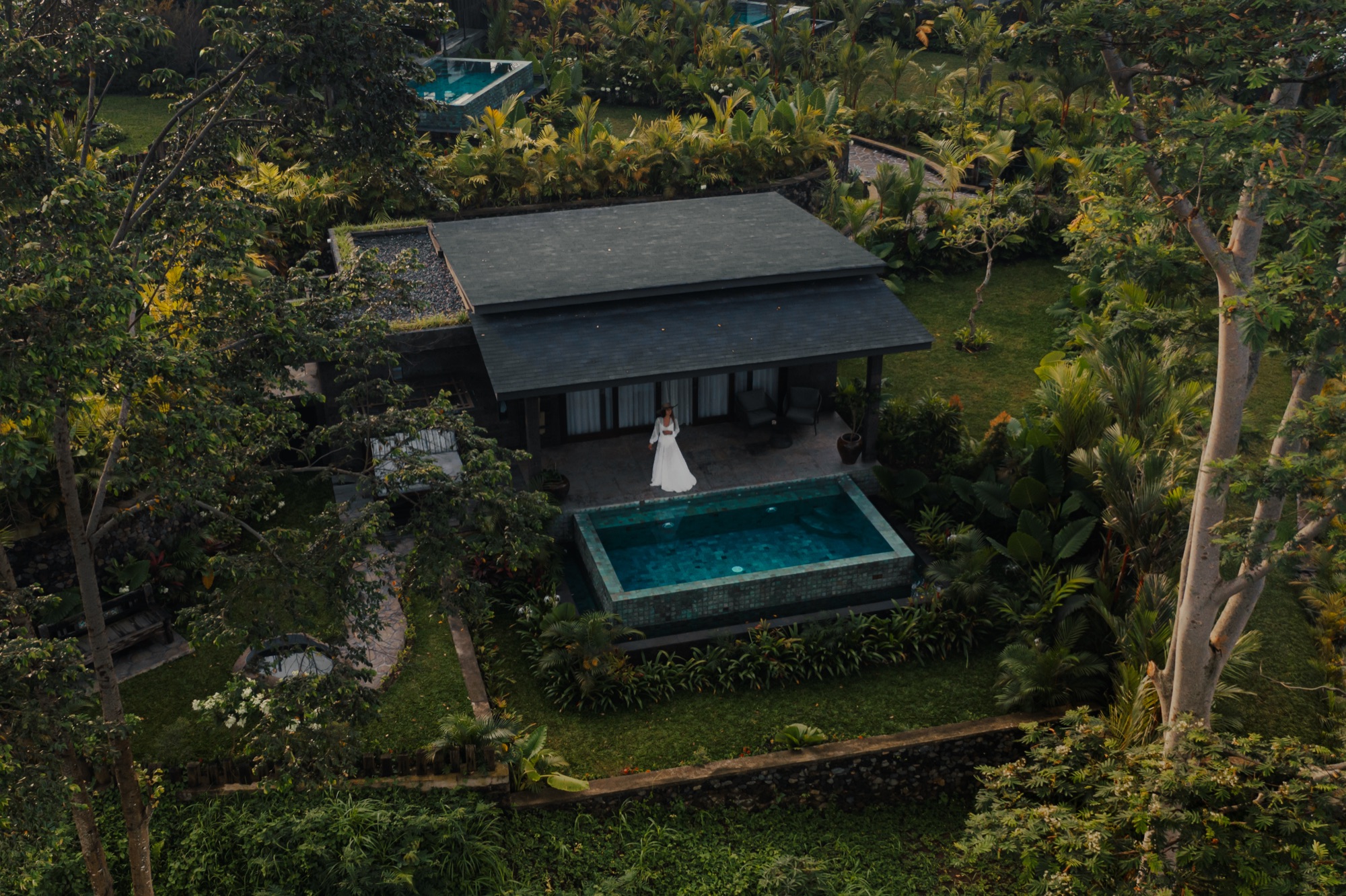Aerial view of a Wellness Villa with private pool surrounded by tropical garden