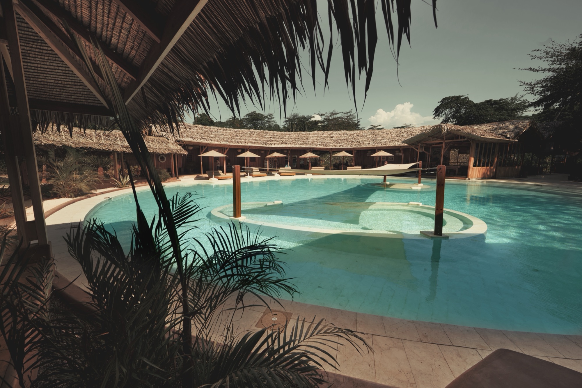 The freeform saltwater pool with a sunken bar at the heart of the resort