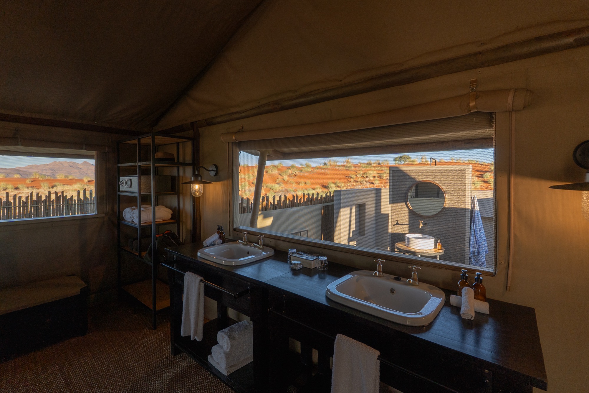 Double basin under a wide window looking onto the desert