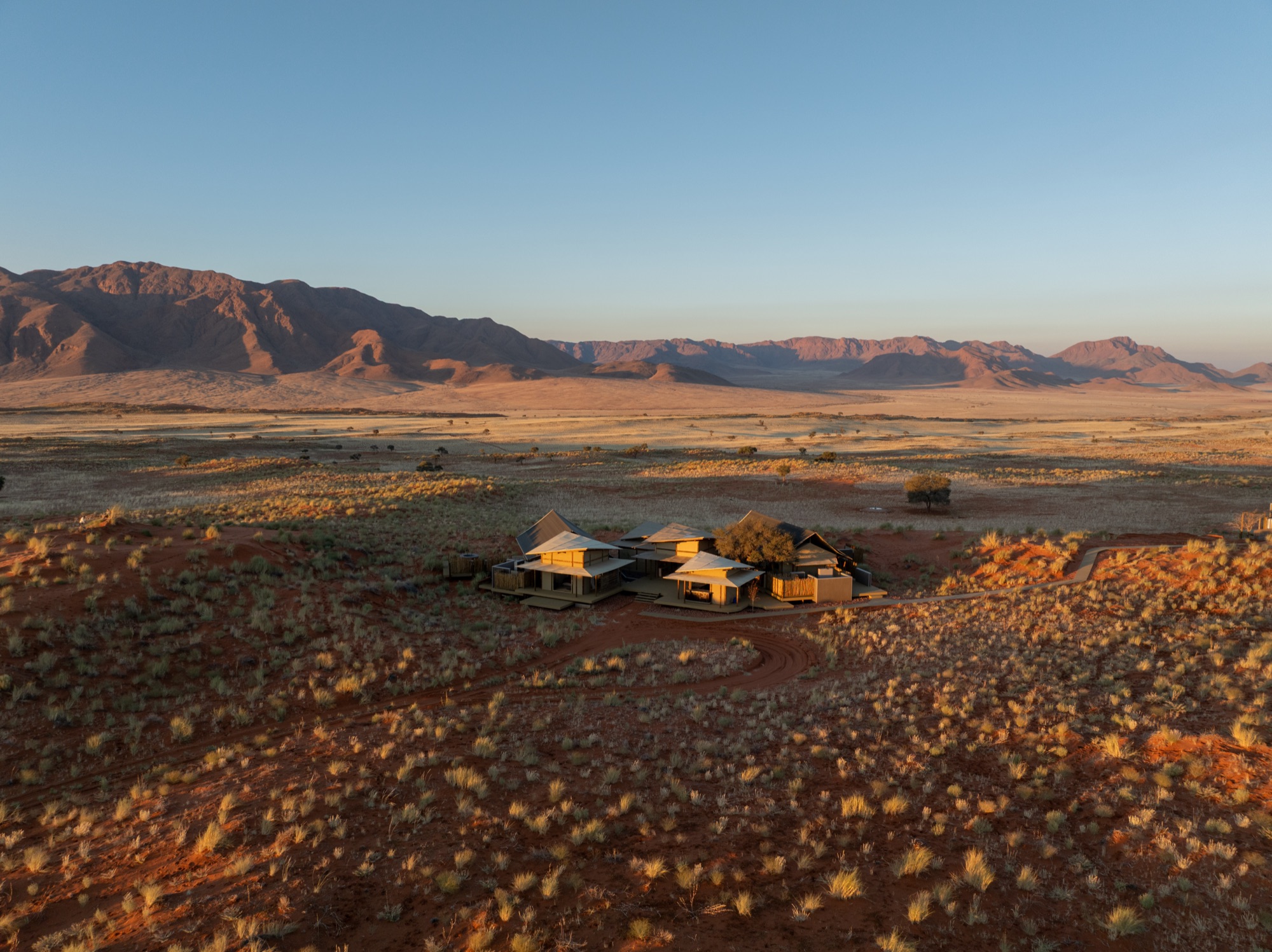 Aerial view of the Family Suite on the plains, mountains in the distance
