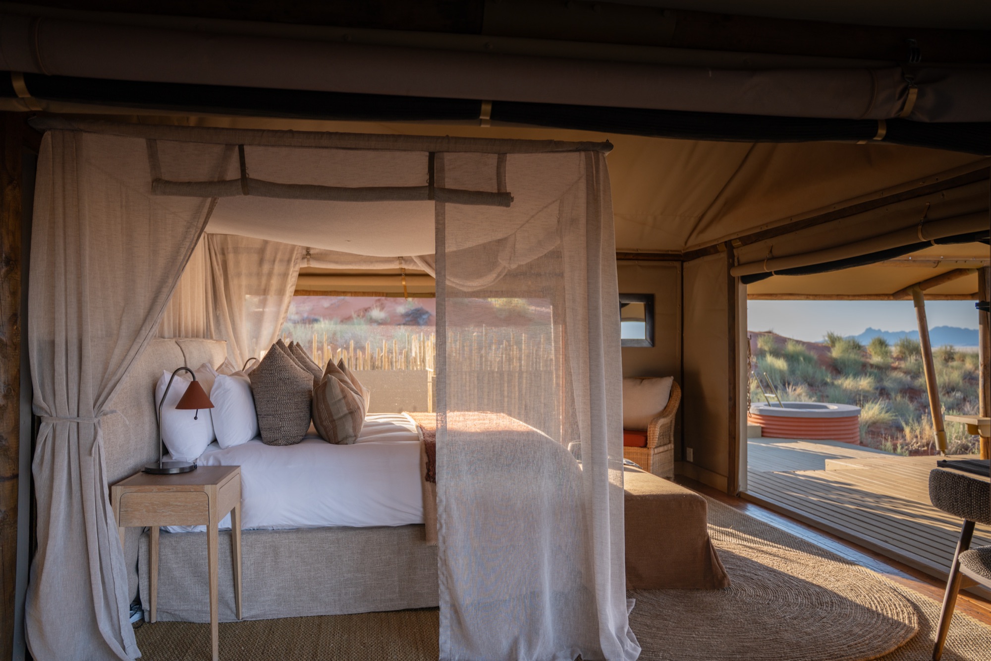 Four-poster bed with a mosquito net in a Family Suite room