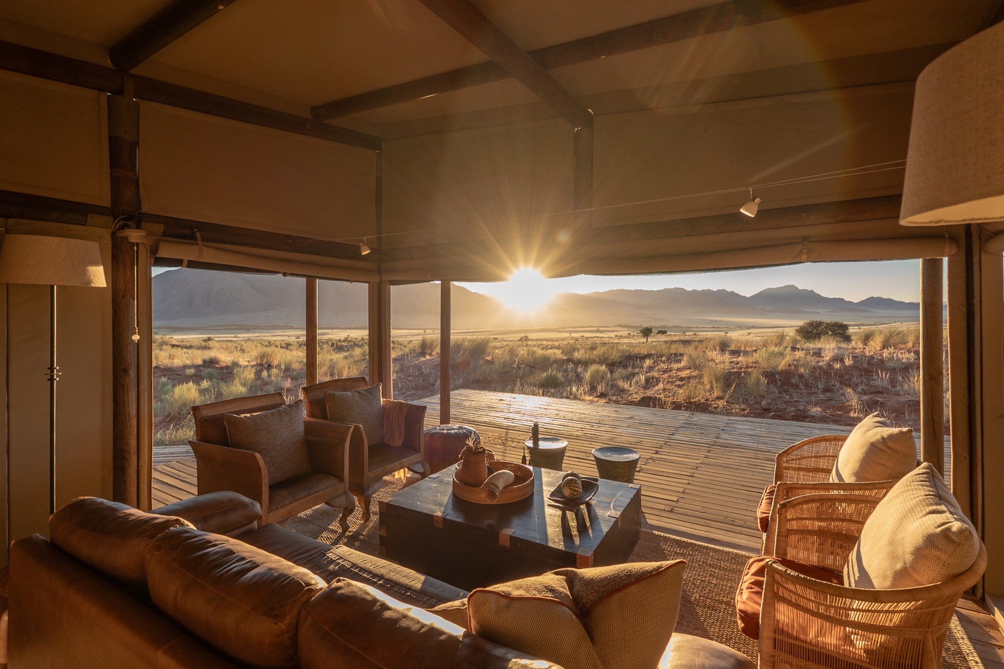 Family Suite lounge with leather sofas facing the sunset